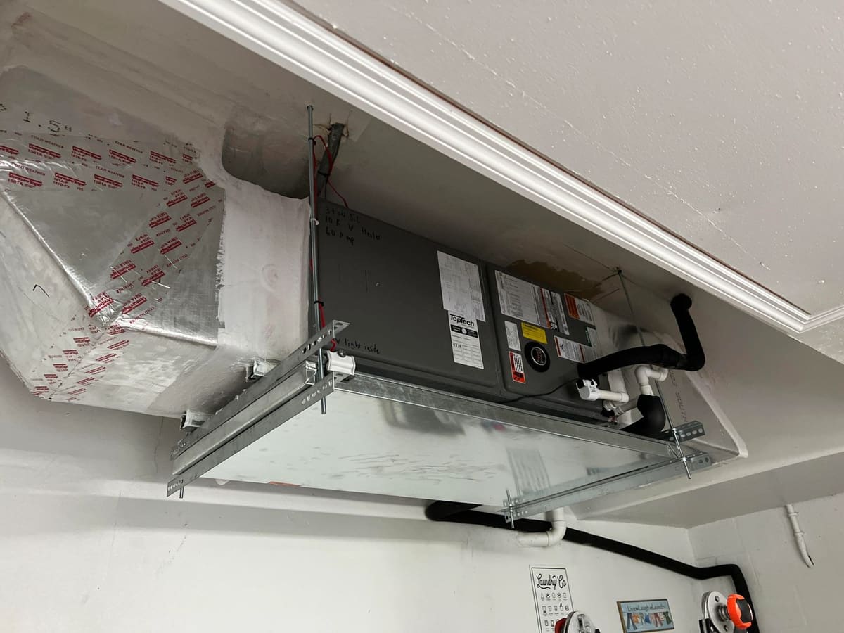 Ceiling-suspended air handler installation in a garage, cleanly supported and sealed, Lightning Fast A/C & Heating, FishHawk / Lithia FL